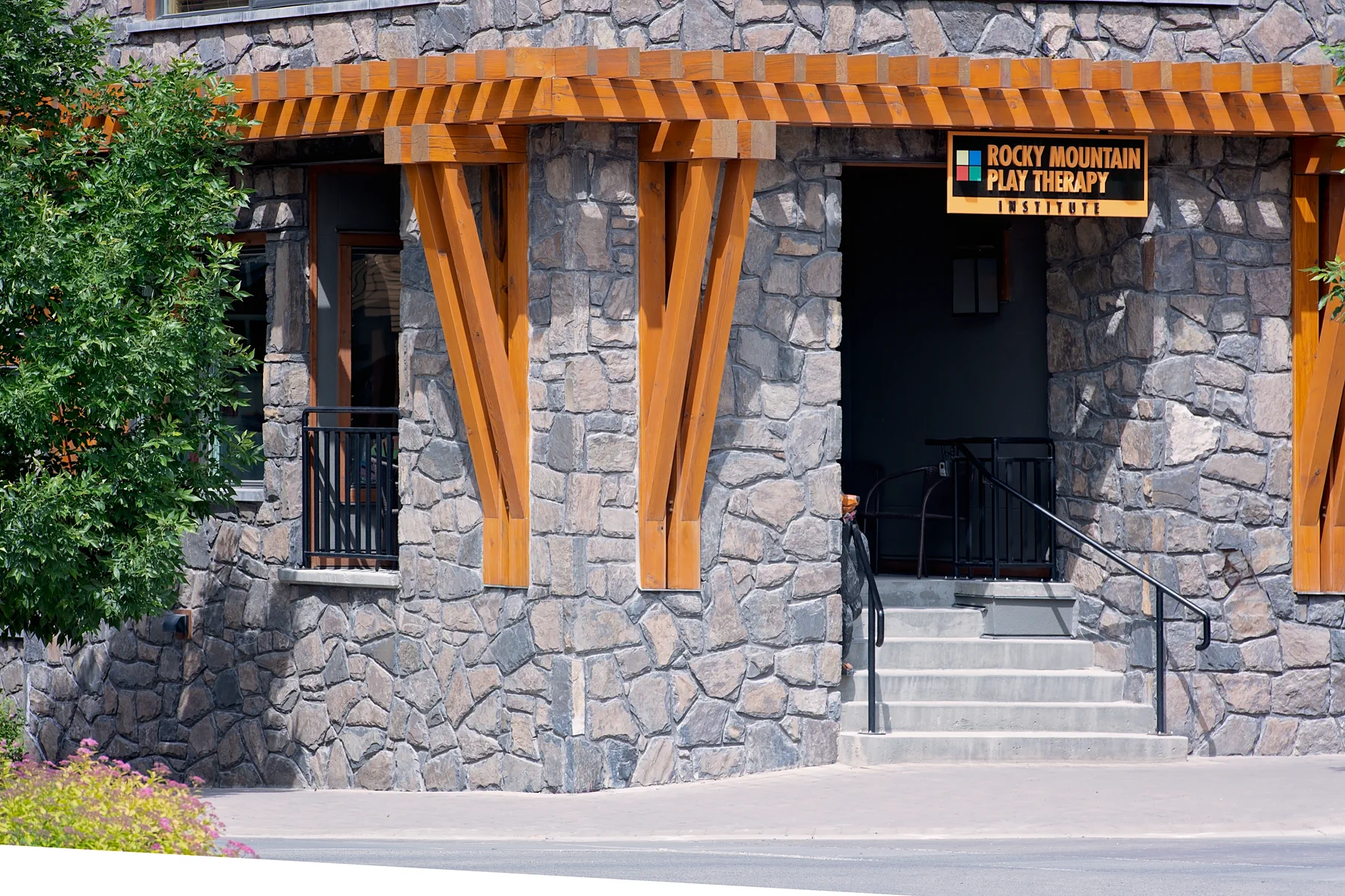 Timber and stone entrance at White Spruce Lodge